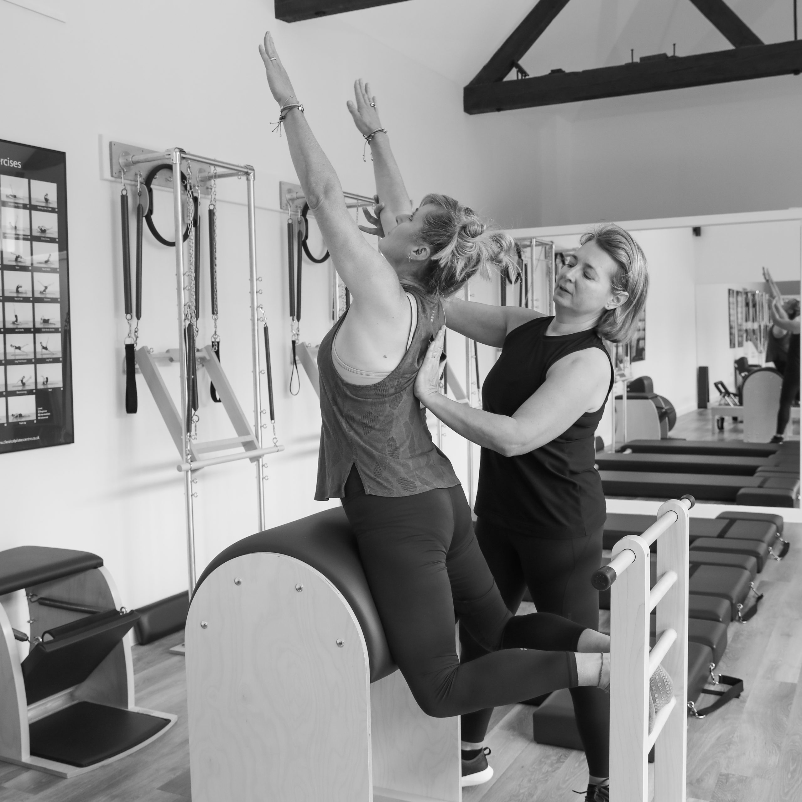Practising classical Pilates Reformer exercises under the guidance of a BodyAct Pilates instructor.