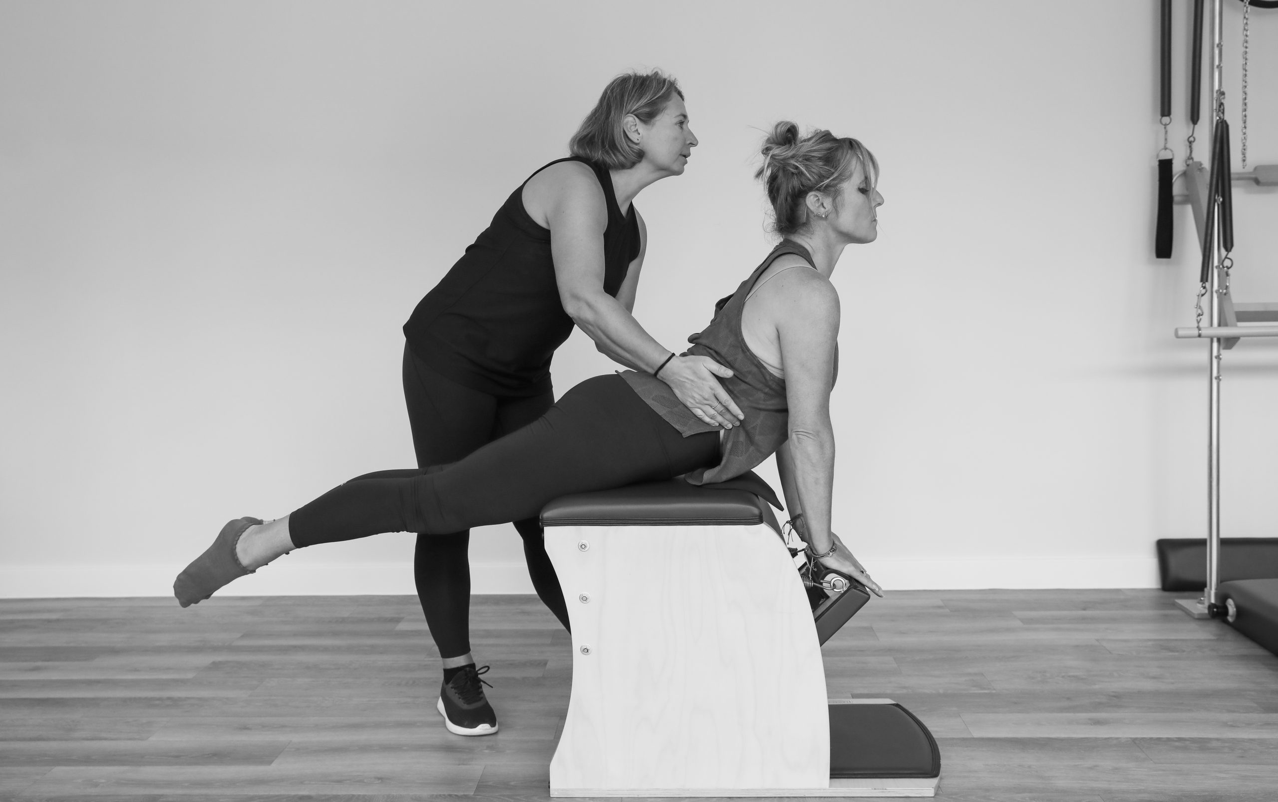 Practising classical Pilates Reformer exercises under the guidance of a BodyAct Pilates instructor.